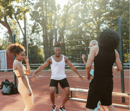 Young people dancing on a sports pitch