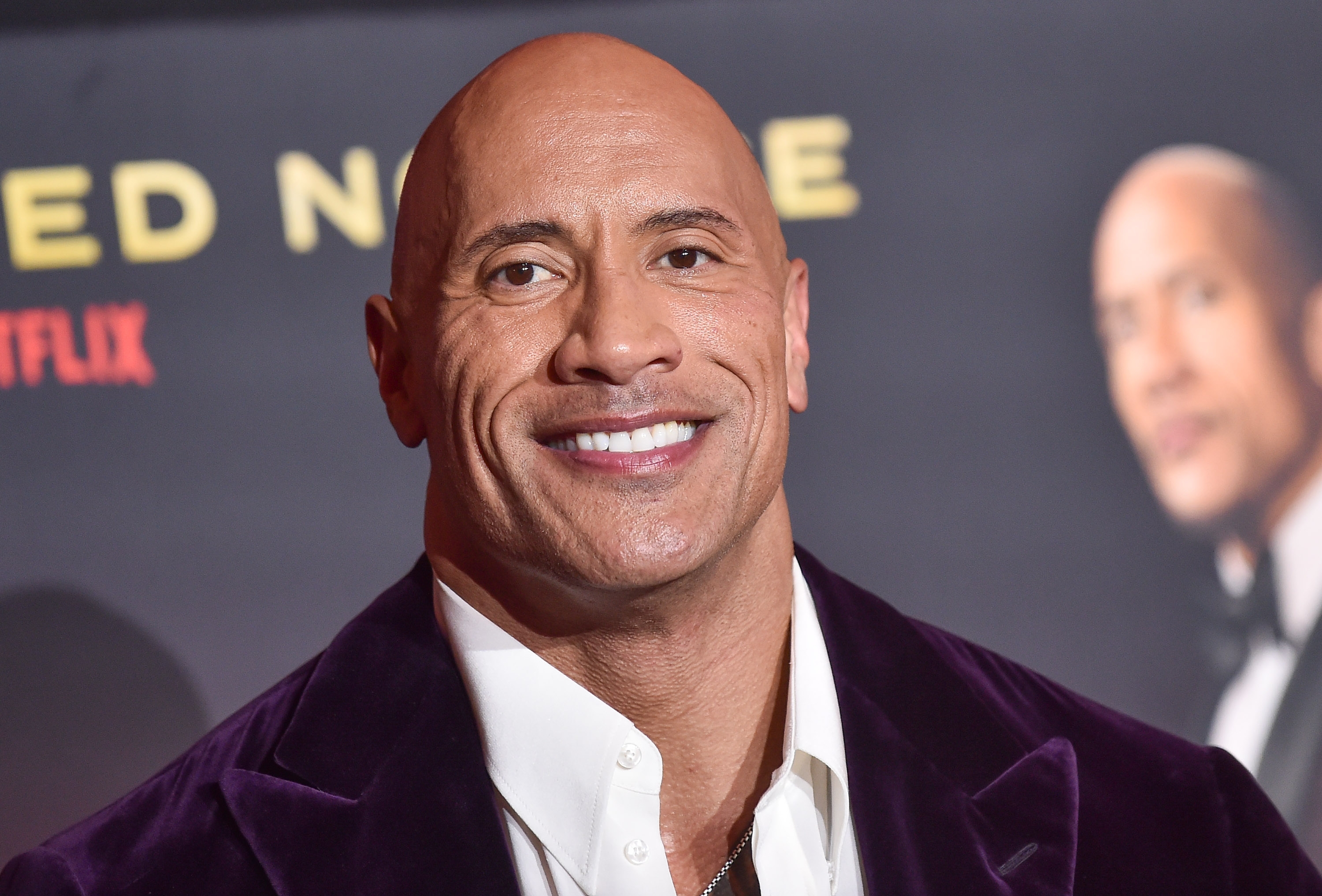 Headshot of Dwayne Johnson smiling