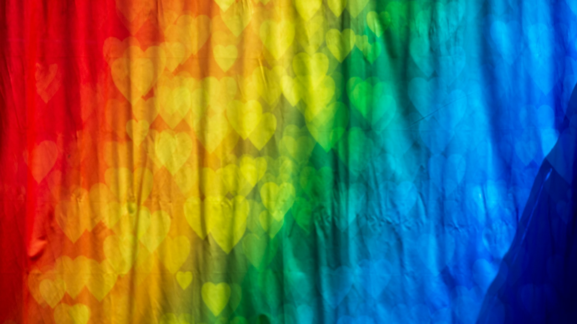 Background of colors, starting with red to dark blue.